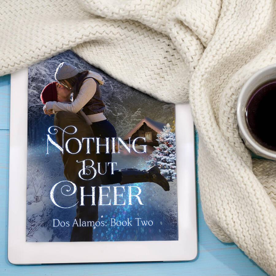 Nothing But Cheer on tablet with cozy scarf and coffee.